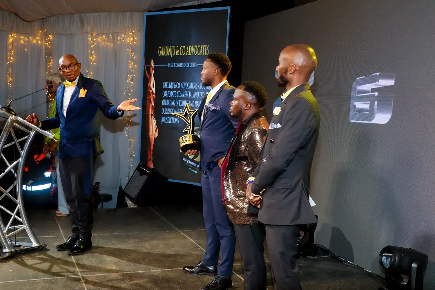 The category being announced on stage at the ETA Awards