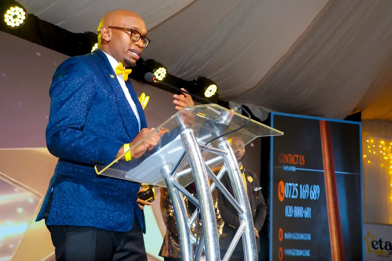 A speech being given from the podium at the ETA Awards