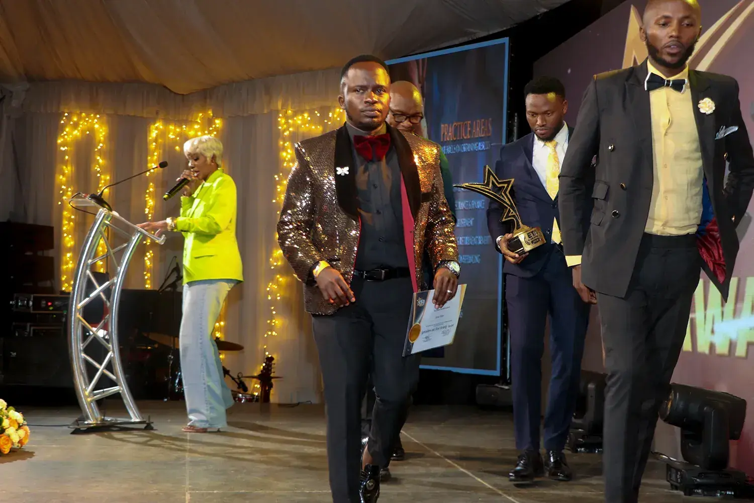 The ETA Awards trophy held up on stage after the announcement
