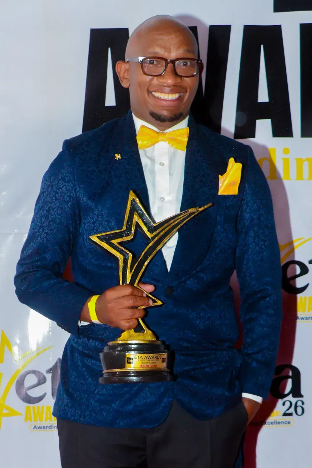Siloma Stephen holding the ETA Awards star trophy at the 2026 ceremony